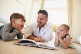 kids reading at home with parent